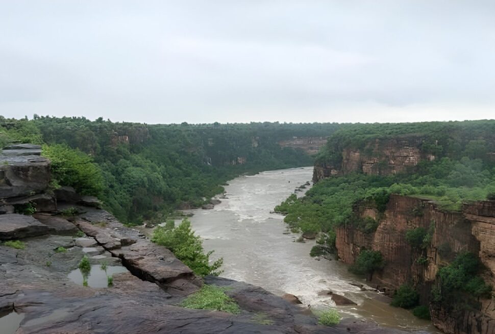 Rewa Madhya Pradesh waterfall surrounded by forested plateau and monsoon landscape